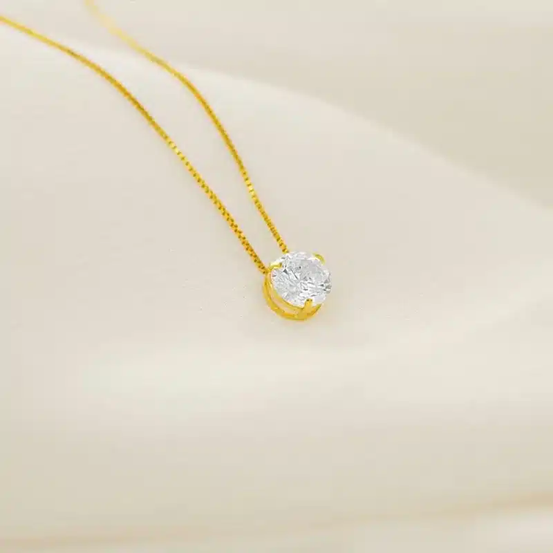 Joias e Relógios para Usar no Réveillon: Looks de Fim de Ano que Brilham! 4 joias e relogios para usar no reveillon Pingente em Ouro 18k Ponto de Luz PG20200 2